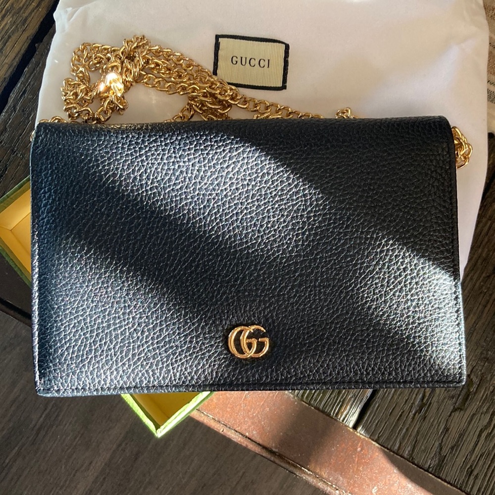 GG crossbody or clutch.